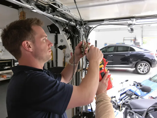 Wilmington Garage Door Repair safety certified technician performing cable replacement in Wilmington