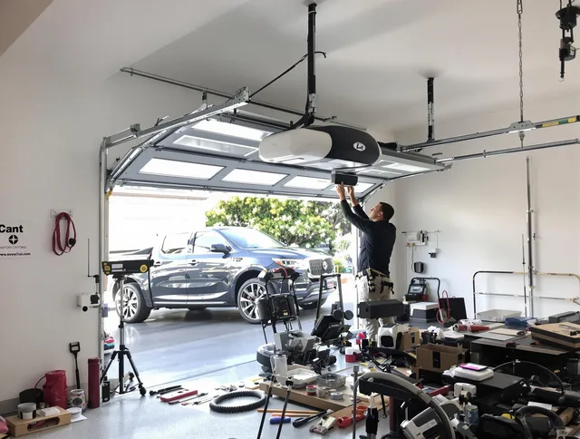 Wilmington Garage Door Repair specialist installing smart garage door opener system in Wilmington home