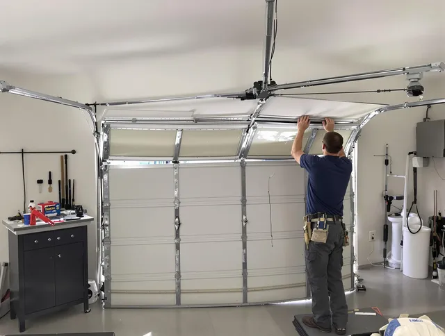 Wilmington Garage Door Repair specialist performing precise section replacement on Wilmington garage door